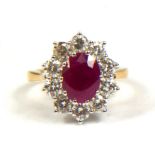AN 18CT YELLOW GOLD, OVAL RUBY AND DIAMOND CLUSTER RING. (Ruby 2.25ct. Diamonds 1.50ct)