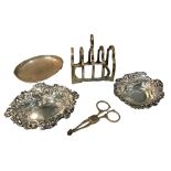 JAMES DEAKIN & SONS, A SILVER TOAST RACK TOGETHER A PAIR OF SUGAR NIPS, TWO REPOUSSÉ DISHES AND