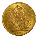 AN EARLY 20TH CENTURY 22CT GOLD SOVEREIGN COIN, DATED 1928 With King George V bust and George and