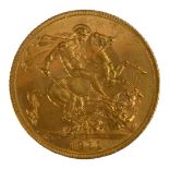 AN EARLY 20TH CENTURY 22CT GOLD SOVEREIGN COIN, DATED 1911 With King George V bust and George and