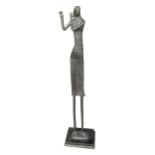 AN EARLY 20TH CENTURY FLOOR STANDING ABSTRACT BRONZE SCULPTURE, A WOMAN PLAYING THE FLUTE. (h 117.