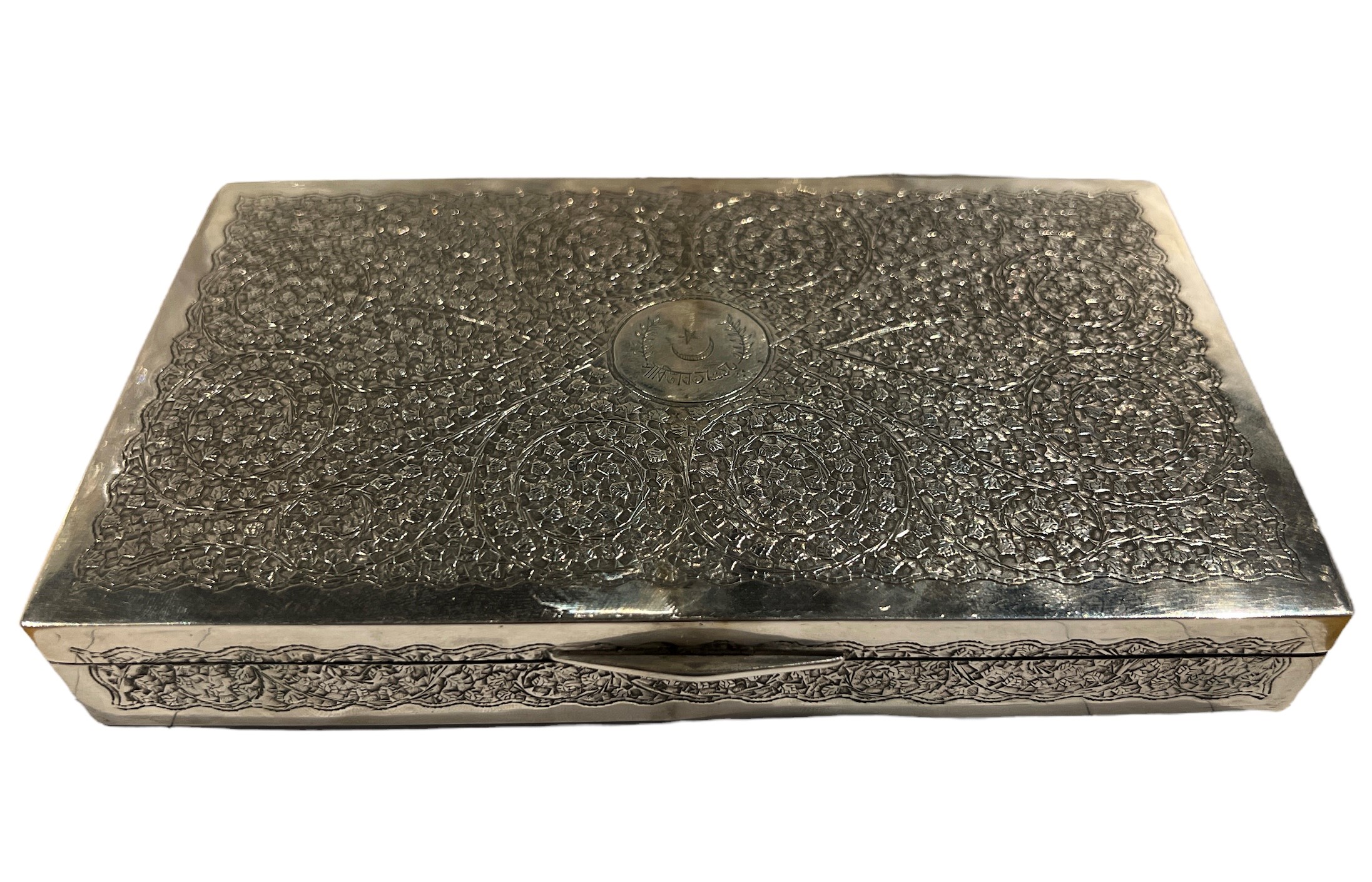 AN EARLY 20TH CENTURY ISLAMIC SILVER CIGARETTE BOX Having engraved cartouche with star inside semi-