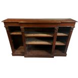 A WILLIAM IV DESIGN CARVED MAHOGANY FLOORSTANDING BREAKFRONT BOOKCASE With adjustable shelves,