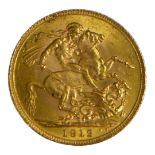 AN EARLY 20TH CENTURY 22CT GOLD SOVEREIGN COIN, DATED 1912 With King George V bust and George and