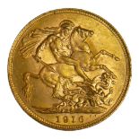 A WWI 22CT GOLD SOVEREIGN COIN, DATED 1916 With King George V bust and George and Dragon to reverse.