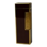DUNHILL, A VINTAGE GOLD PLATE AND ROUGE ENAMEL CIGARETTE LIGHTER Marked to base ‘520 G3’, in a