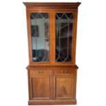 MAPLE & CO., A LATE 19TH CENTURY INLAID MAHOGANY BOOKCASE With glazed doors opening to reveal