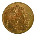 AN EARLY 20TH CENTURY 22CT GOLD SOVEREIGN COIN, DATED 1928 With King George V bust and George and
