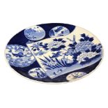 A LARGE 19TH CENTURY JAPANESE BLUE AND WHITE CHARGER Decorated with various depictions of birds,