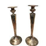 DOMINICK & HAFF, 1869 - 1928, A PAIR OF AMERICAN STERLING SILVER CANDLESTICKS Having ‘V’ shaped