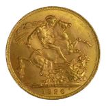 AN EARLY 20TH CENTURY 22CT GOLD SOVEREIGN COIN, DATED 1926 With King George V bust and George and