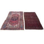TWO ANTIQUE CARPETS/RUG To include red ground stylised geometrical border with repeating geometric