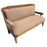 A 19TH CENTURY CONTINENTAL WALNUT UPHOLSTERED SETTEE Raised on turned legs. (h 101cm x d 66cm x w