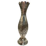 A 20TH CENTURY PERSIAN/IRANIAN SILVER VASE Having four floral chased relief panels, surrounded by