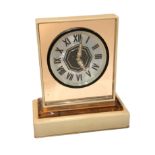CARTIER, PARIS, AN ART DECO MOTHER OF PEARL, ROSE GILDED METAL AND ENAMEL MIRRORED DESK CLOCK The