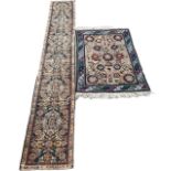 TWO ANTIQUE CARPETS/RUGS To include a Kuba with stylised motifs and a runner with central diamond