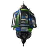 A COLLECTION OF FOUR PERSIAN DESIGN COLOURED GLASS HANGING LANTERNS To include one large, one pair