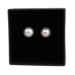 A PAIR OF 9CT YELLOW GOLD SILVER/PINK FRESHWATER CULTURED PEARL STUDS. Boxed