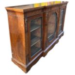 A 19TH CENTURY VICTORIAN WALNUT AND GILT METAL MOUNTED BREAKFRONT CREDENZA With floral inlaid and