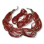 A COLLECTION OF THREE VINTAGE CONTINENTAL WHITE METAL AND RED CORAL NECKLACES