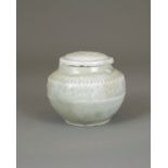 A moulded Qingbai Jar and Cover, Song Dynasty H:6cm the domed top with a floral roundel in low