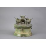 A Dian kingdom style drum shaped Bronze Lid H: 18cm with five standing figures of longhorned