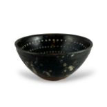 A Jizhou style Blackware Teabowl W:12cm the interior decorated with precise concentric bands of pale