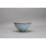 A Jun type Bowl, possibly Jin Dynasty W: 12.5cm with overall pale blue glaze draining to grey at the