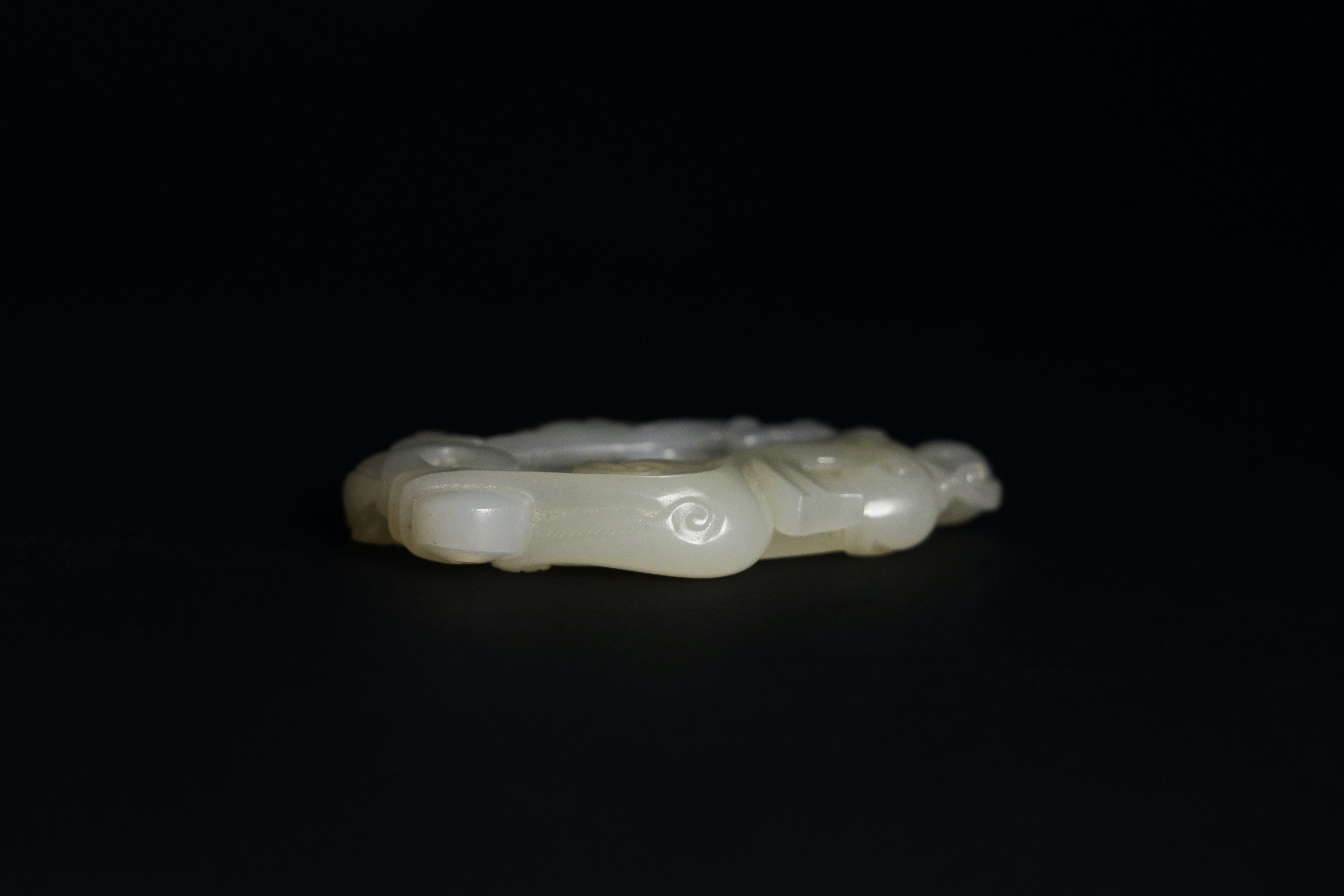 A White Jade Bi Disc Pendant, Qianlong L:6.5cm the oval disc finely carved with archaistic 'c' - Image 4 of 6