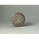 A Round Silver Box and Cover, late 19th century W:8.5cm finely modelled overall in low relief with