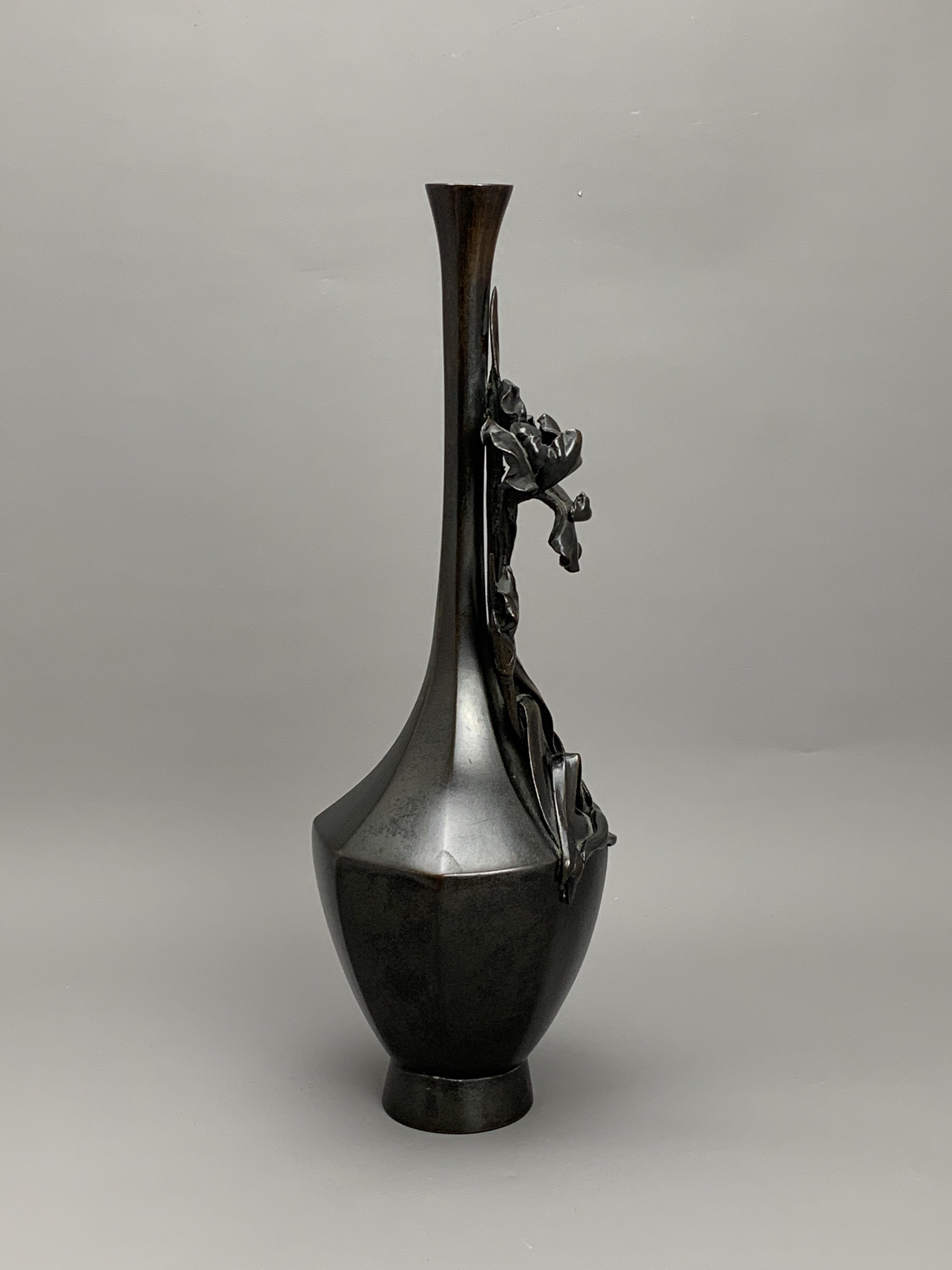 A Japanese Bronze 'Iris' Vase, Meiji period H:35.5cm the elegant tall bottle vase of hexagonal