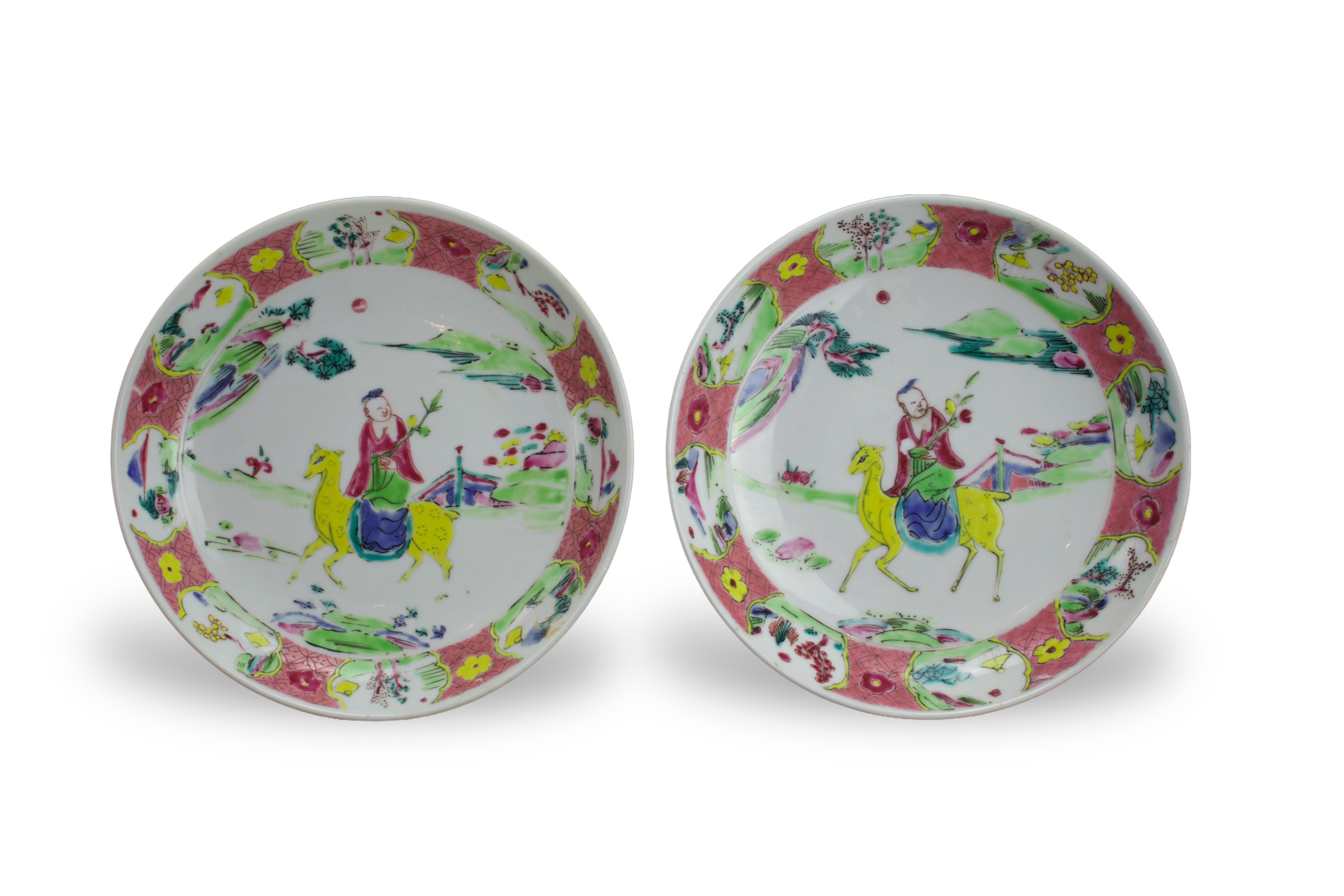 A Pair of 'famille rose' Saucer Dishes, Yongzheng W: 16.2cm brightly enamelled with a boy riding a