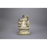 A Cizhou type stoneware Group, Ming dynasty (1368 - 1644) H: 23.5cm depicting a seated dignitary,