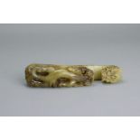 A Brown Jade Dragon Belthook, 19th/20th century L:12.5cm with dragon head hook and a qilong carved
