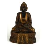 A BRONZE STATUE OF A SEATED BUDDHA. (18cm)