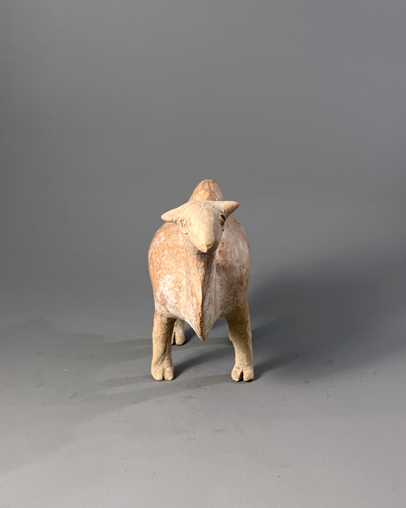 A Qijia style Pottery Camel L:17.7cm the smooth reddish buff pottery formed as a Bactrian camel - Image 3 of 7