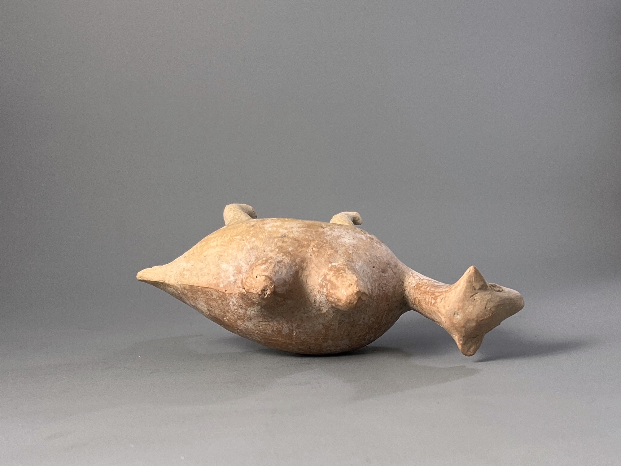 A Qijia style Pottery Camel L:17.7cm the smooth reddish buff pottery formed as a Bactrian camel - Image 7 of 7