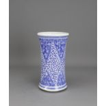 H:20cm of waisted cylindrical form, well decorated with triangular blue ground foliate lappets