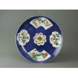 A Blue Ground 'famille verte' Saucer Dish, Kangxi W: 27cm with two lobed and two fan shaped