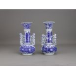 A Rare Pair of Blue and White Bottle Vases, Kangxi H:20cm after a Venetian glass original, decorated