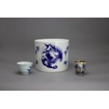 Two blue and white Cups, 18th century, and a blue and white brushpot in Kangxi style Two blue and