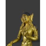 A Gilt Bronze Head and Torso of Tara, 19th century or earlier H:25cm overall her serene face