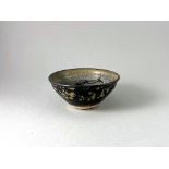 A Jizhou style Phoenix Teabowl W: 11.5cm the interior resist decorated with flowerheads and a pair