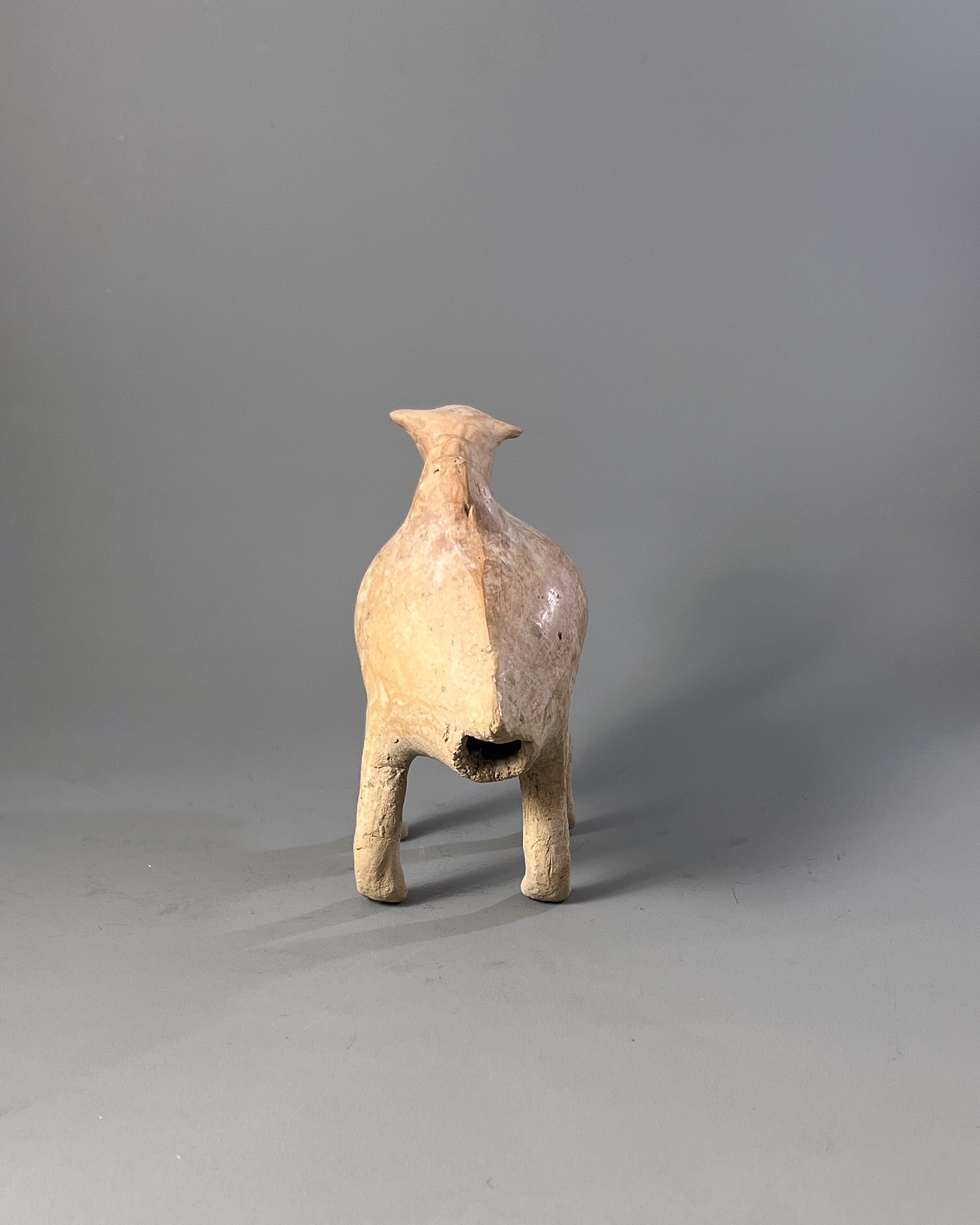 A Qijia style Pottery Camel L:17.7cm the smooth reddish buff pottery formed as a Bactrian camel - Image 4 of 7