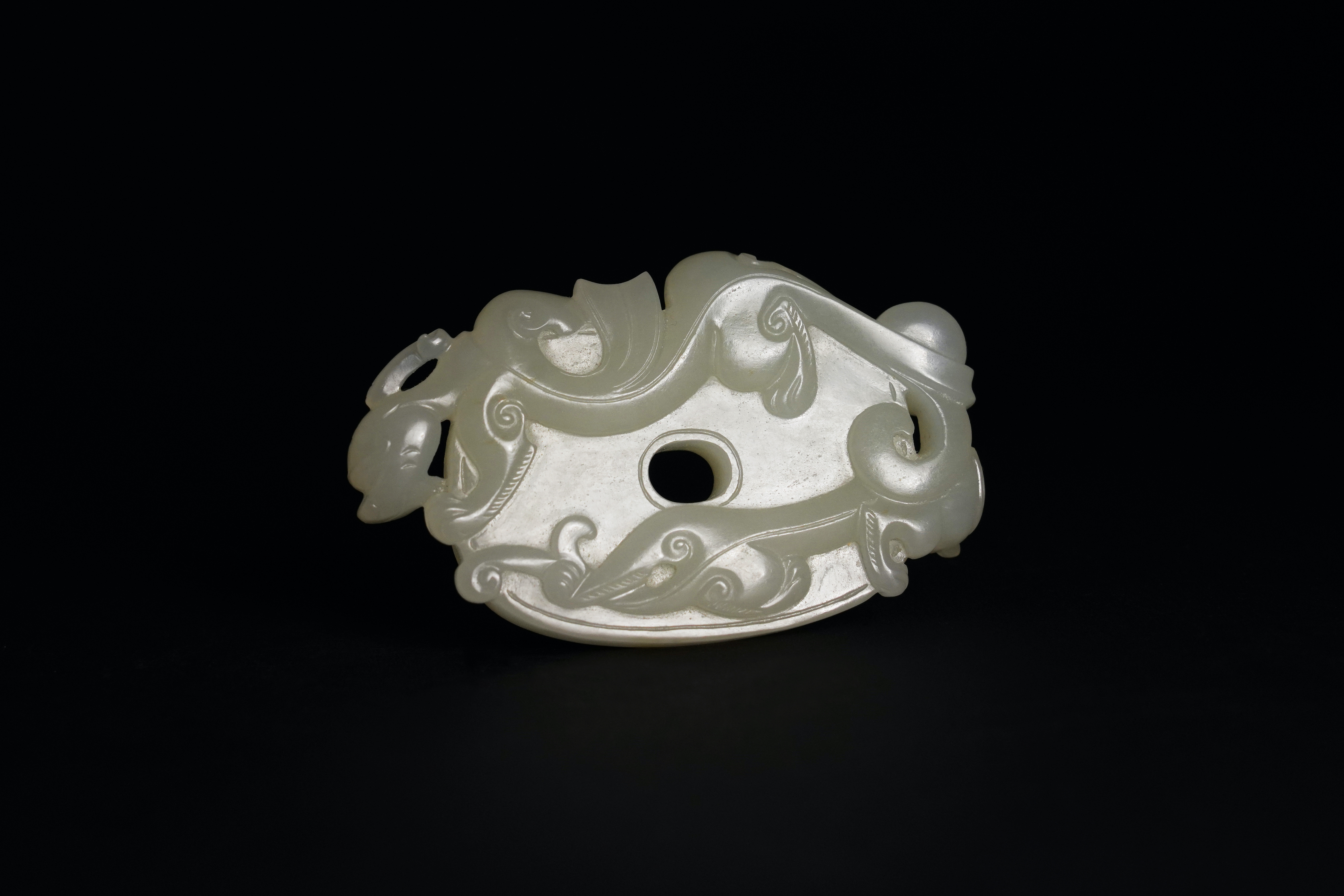 A White Jade Bi Disc Pendant, Qianlong L:6.5cm the oval disc finely carved with archaistic 'c'