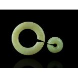 Two Archaic Jade Rings, jue, Hongshan culture the larger W:5cm both softly polished rounded rings