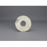 An Interesting Ceramic Bi Disc, Tang dynasty or earlier the slender disc worked in imitation of a