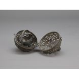 A Rare Pierced Silver Pendent Censer, Tang dynasty D:5.4cm of globular form, hanging from a hook and