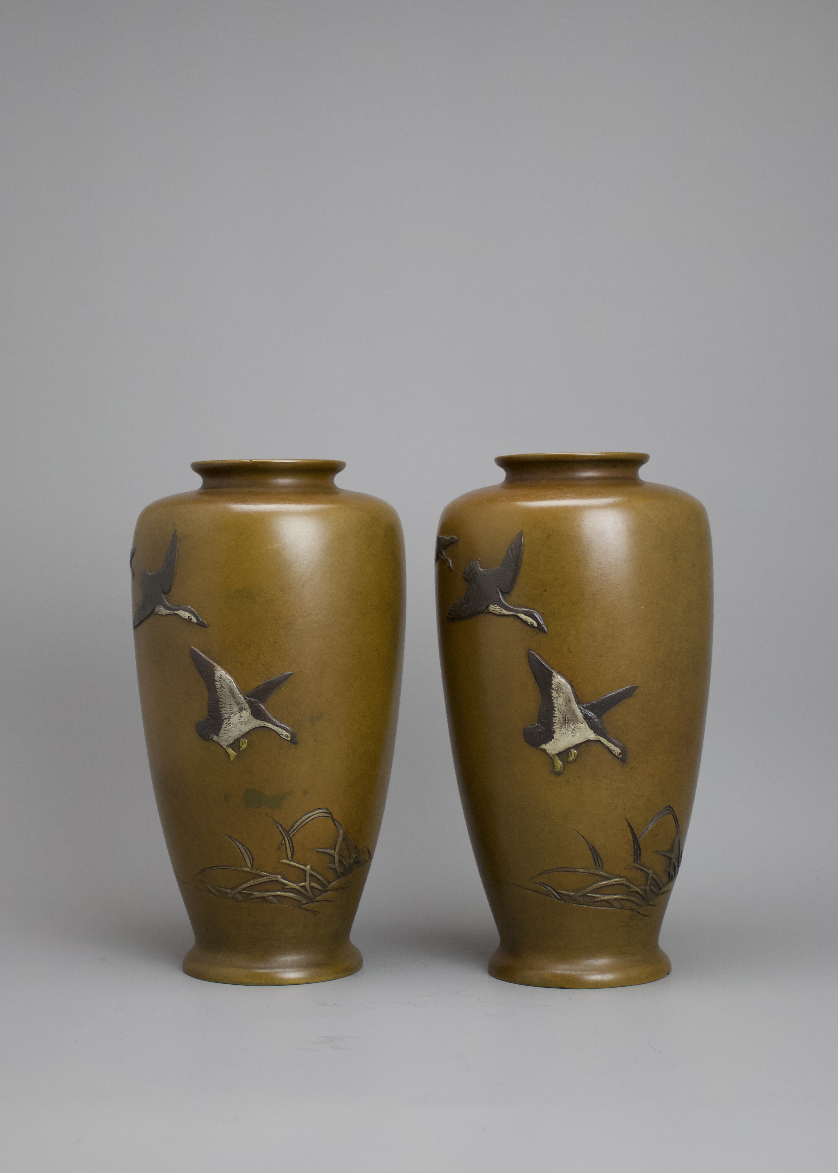 A Pair of Mixed Metal Japanese Vases, Meiji period H: 22cm decorated with three geese descending