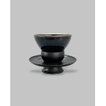 A Jian type Blackware Bowl W:13cm the shiny black glaze with paler brown streaking, draining to a